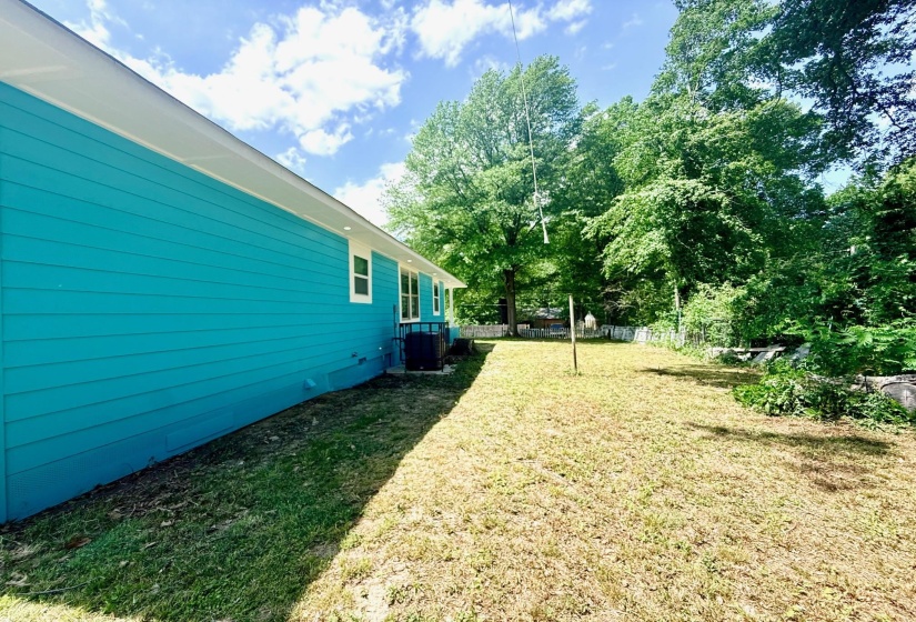Turquoise horizontal siding with white trim