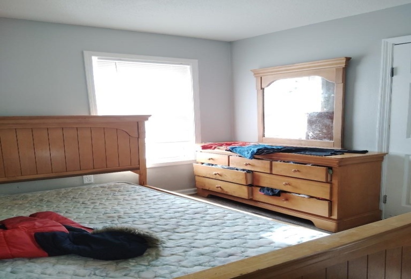 Bedroom with baseboards