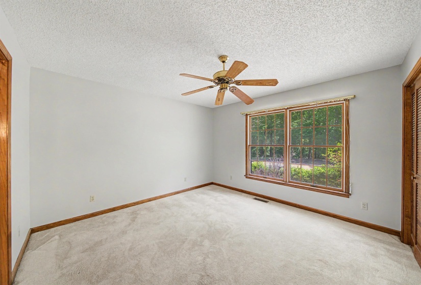 Light gray walls paired with light-toned carpeting