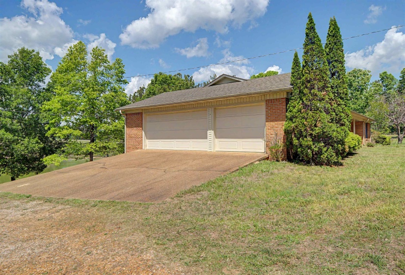 Brick exterior with a dual garage featuring two overhead doors