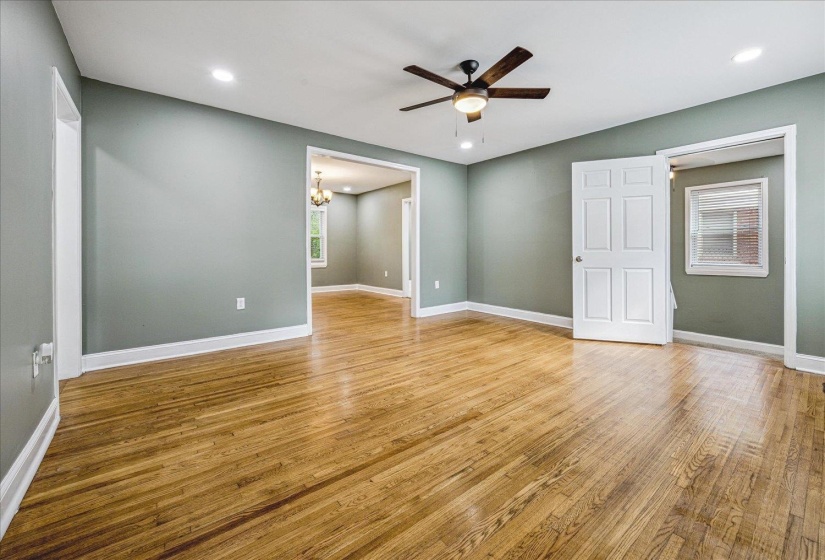 Spacious interior featuring wood-finish flooring, recessed lighting, and a ceiling fan