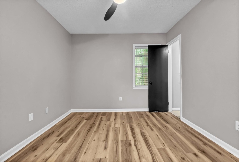 Neutral tone walls with wood-finish flooring