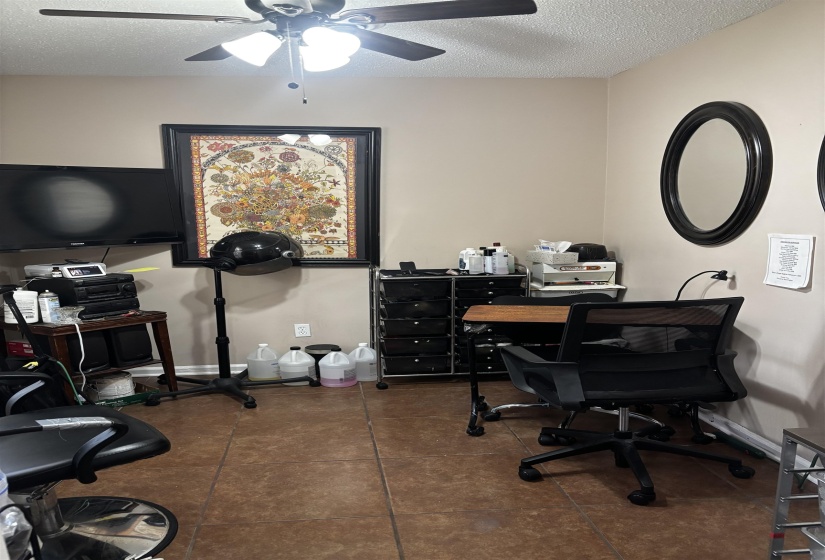 Interior room with tan walls and ceramic tile flooring
