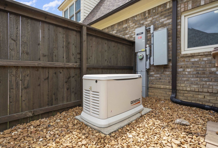 Standby generator on a concrete pad with surrounding gravel