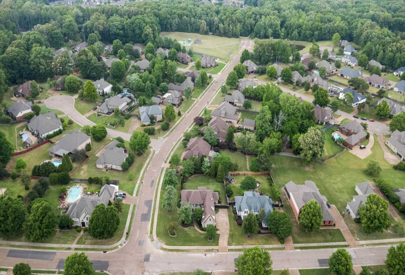 Aerial perspective showcasing a residential community with mature landscaping