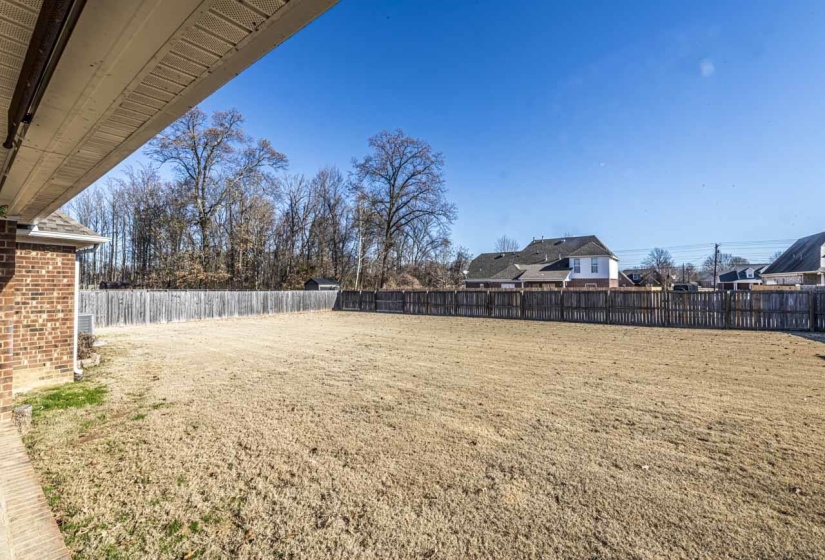 View of fenced backyard