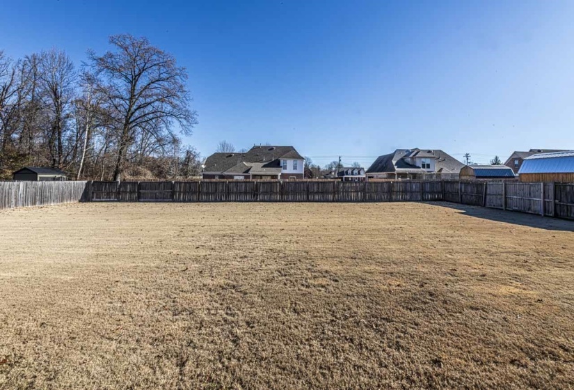 View of fenced backyard