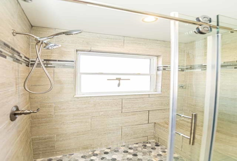 Full bathroom featuring a stall shower and recessed lighting