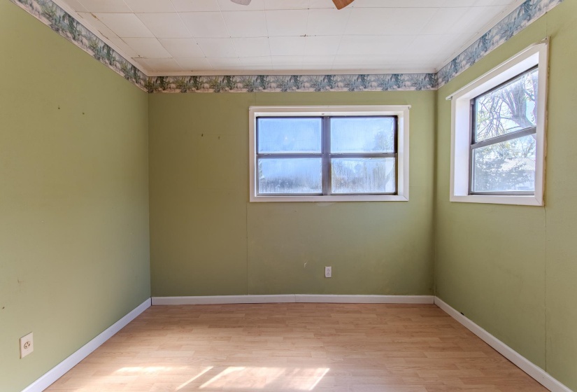 Spare room with light wood-style flooring and baseboards