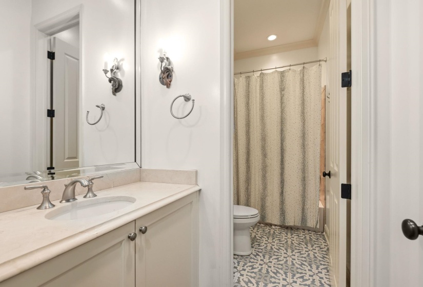 Convenient main level full guest bathroom, ideal for visitors and everyday use.