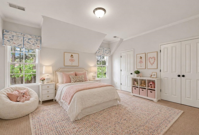 Inviting secondary suite upstairs featuring soft carpeting, abundant natural light from multiple windows, crown molding, charming architectural details, and a private en suite bathroom. Virtually staged.