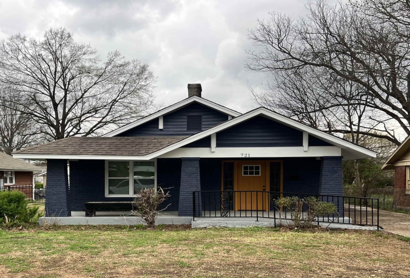 Bungalow-style house with covered porch, brick siding, a chimney, and roof with shingles