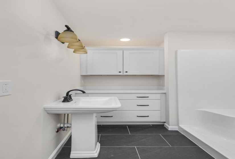 Full bathroom with tile patterned flooring and a shower