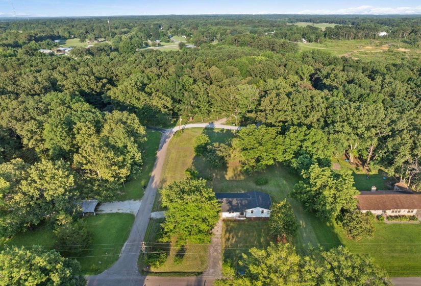 Aerial overview of property's location with a forest