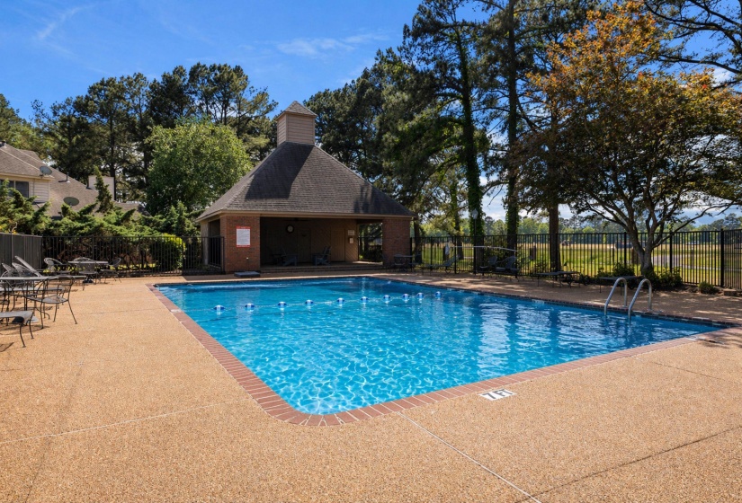 Inviting outdoor swimming pool with a brick-bordered perimeter and ample deck space