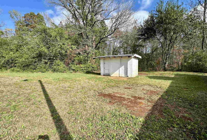 View of yard featuring a storage unit