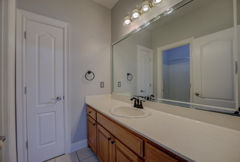 Bathroom with tile patterned floors and vanity