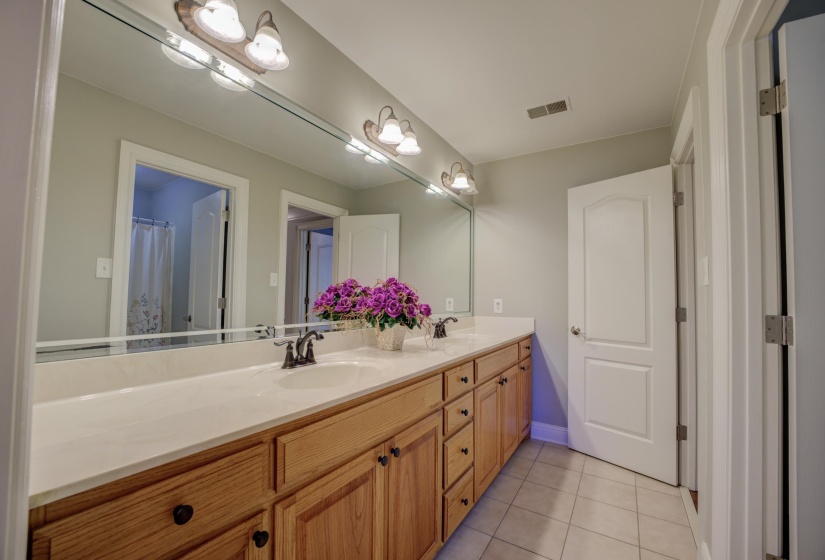 Bathroom with tile patterned floors and vanity