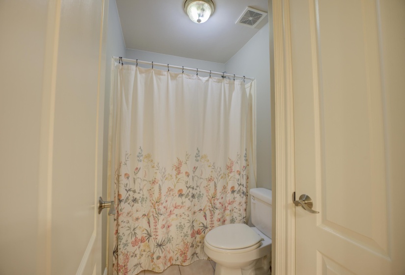 Bathroom with tile patterned flooring and toilet