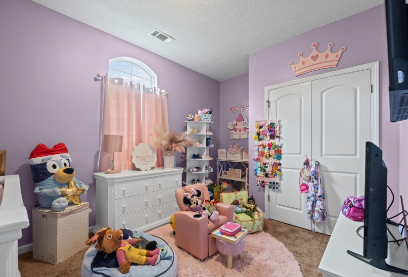 Room featuring light lavender walls and brown carpet flooring