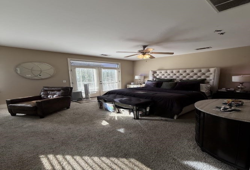 Bedroom with access to outside, carpet floors, french doors, and a ceiling fan