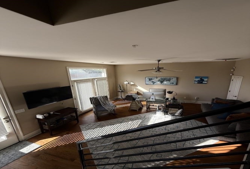 Living room featuring wood finished floors and ceiling fan