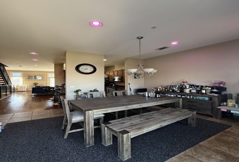 Dining room with recessed lighting, a chandelier, and tile patterned flooring