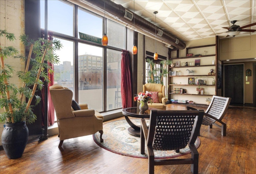 Living area featuring a ceiling fan and wood finished floors