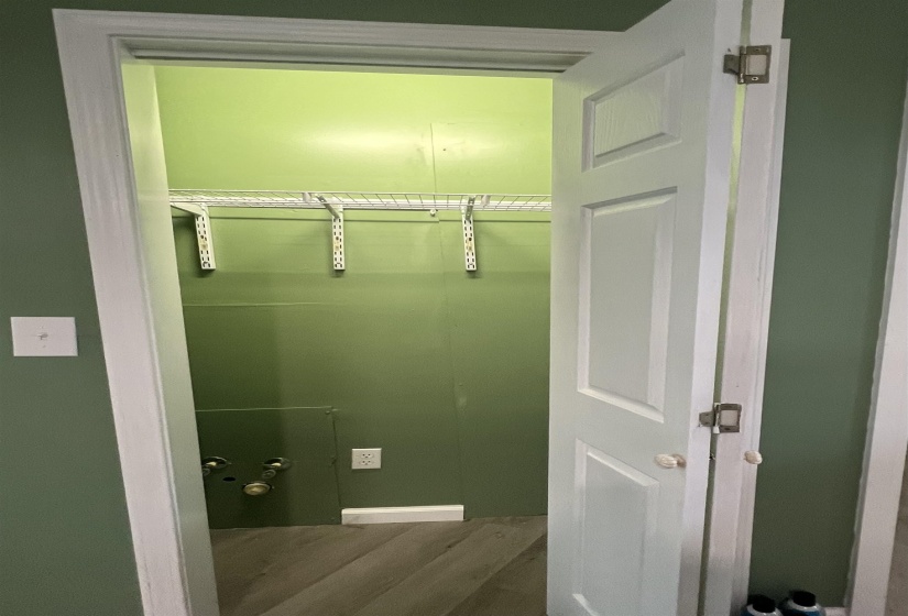 Coat closet featuring, white trim, and wire shelving