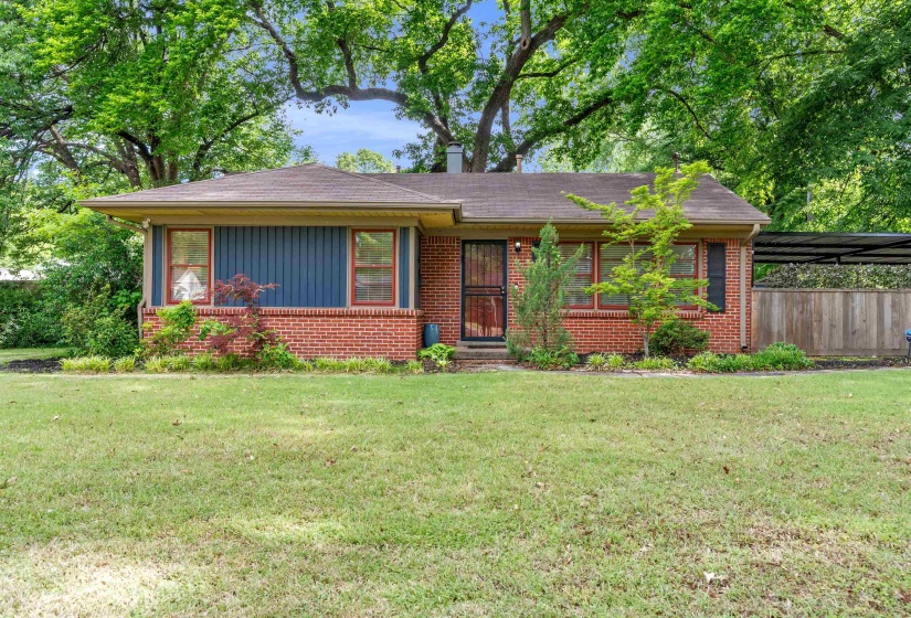 Brick facade home with a spacious front lawn