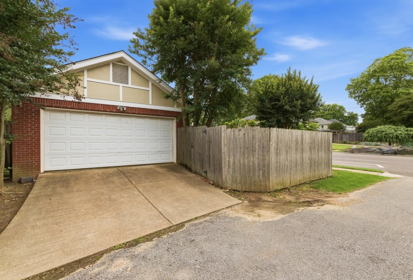 with extra parking pad behind garage