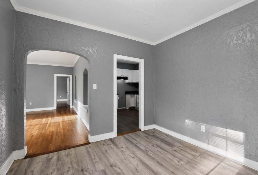 Light wood-finish flooring complements textured gray walls