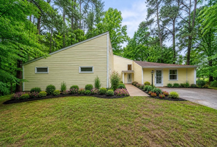 Virtually staged so that you can see what a little bit of sweat equity  and landscaping can do to change the look of the house.