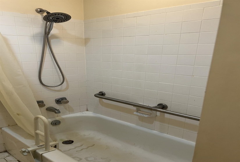 Bathroom featuring shower / bath combo with shower curtain