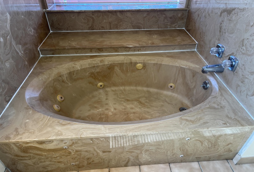 Bathroom featuring a whirlpool tub
