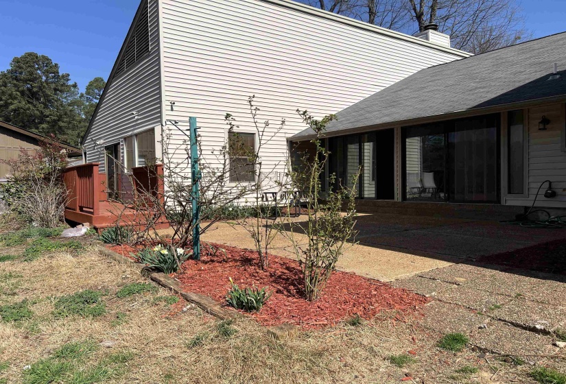 View of property exterior with a walk decking