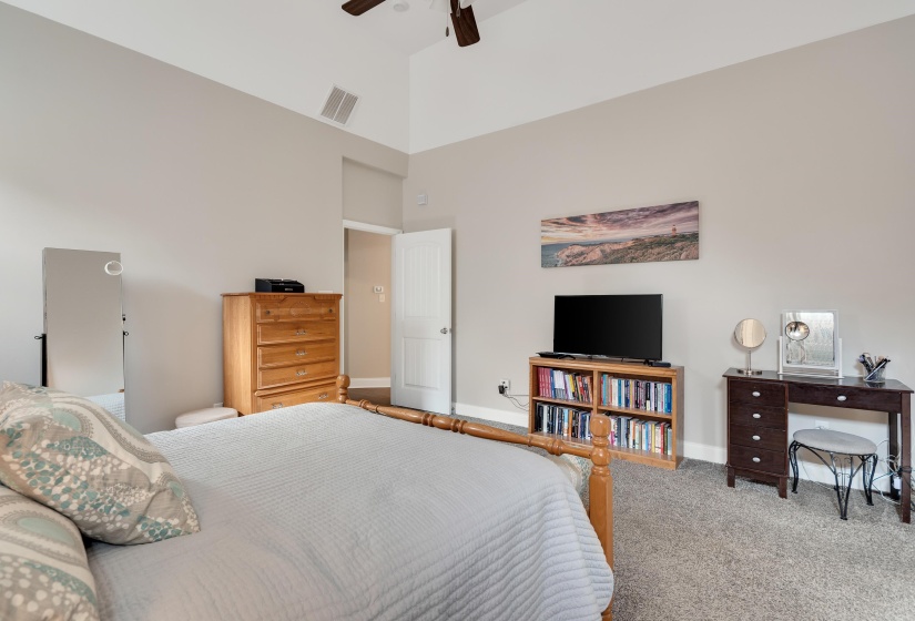 Vaulted ceiling with an overhead fan