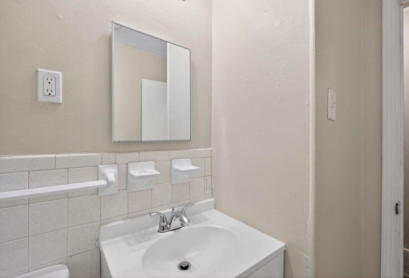 Single vanity with integrated sink and chrome faucet
