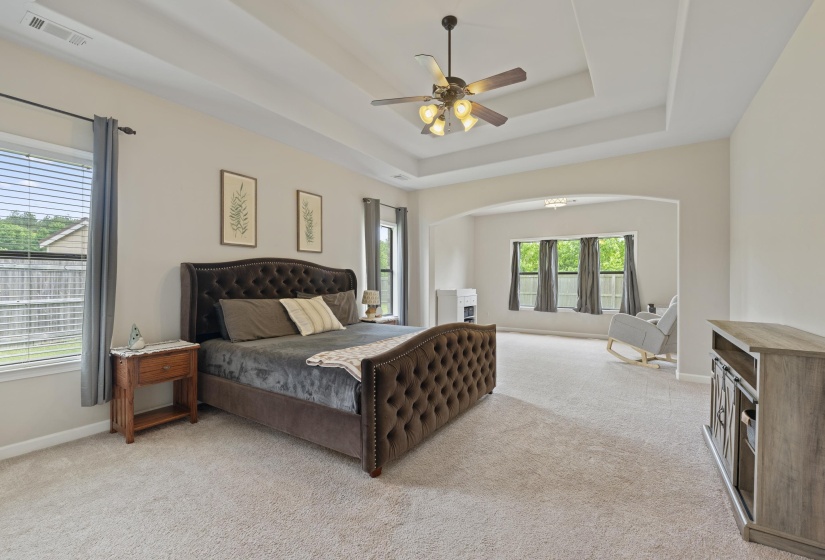 HUGH Primary, featuring a tray ceiling with a ceiling fan