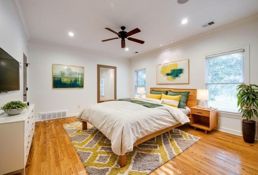 Bedroom with ornamental molding, light wood finished floors, recessed lighting, and ceiling fan