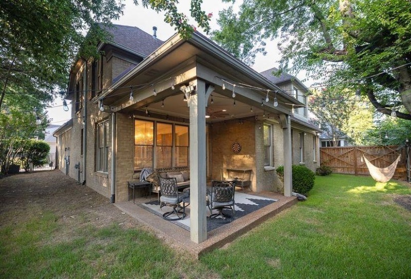 Back of house featuring a yard and a patio area