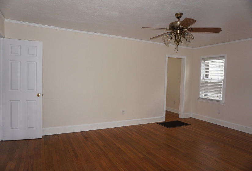 Family Room with wood-finish flooring, neutral wall color, and white trim