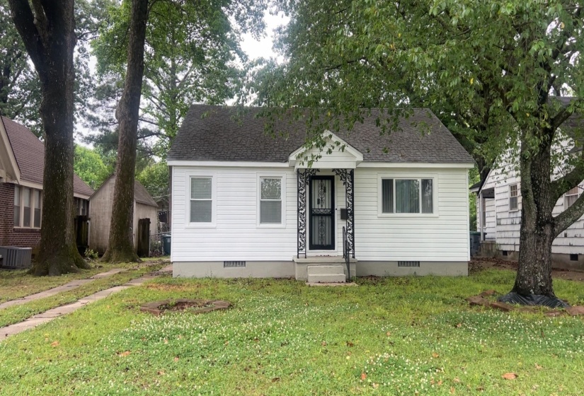 White siding exterior with a dark shingle roof
