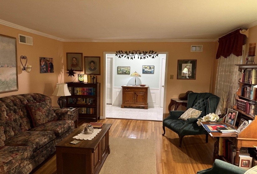 Hardwood flooring extending throughout the living space