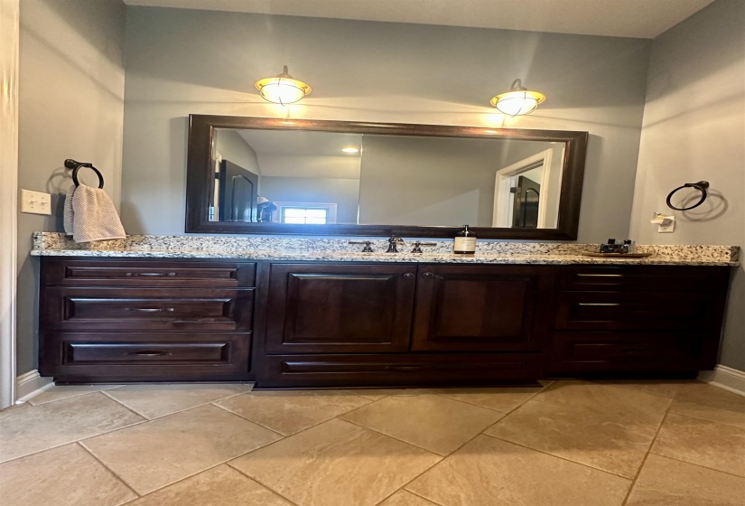 Bathroom with vanity and light tile patterned flooring