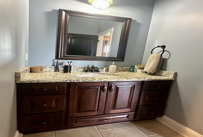 Bathroom featuring vanity and light tile patterned flooring