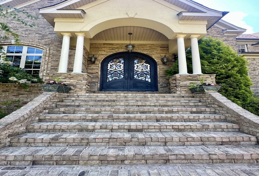 Doorway to property with french doors and brick siding