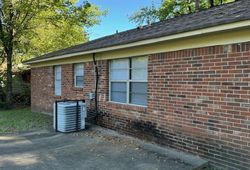 View of property exterior with a patio and cooling unit