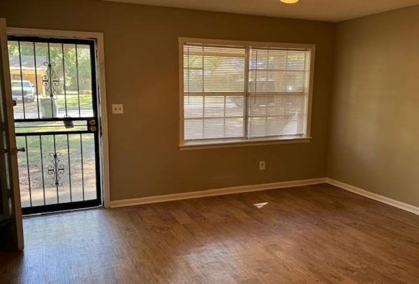 Foyer with hardwood / wood-style floors and plenty of natural light