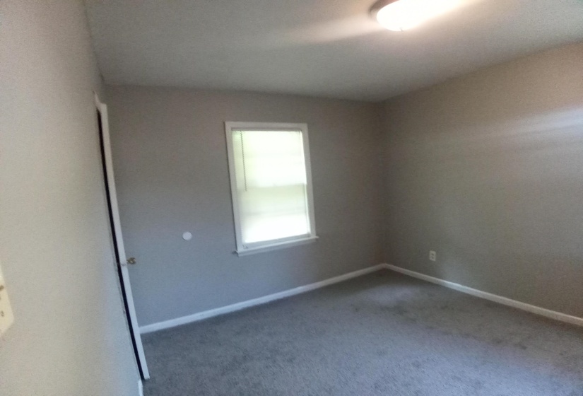 Empty room featuring carpet flooring
